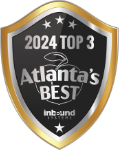 A black and silver shield-shaped badge reads "2024 Top 3 Atlanta’s Best Inbound Systems" with a stylized peach graphic in the background.